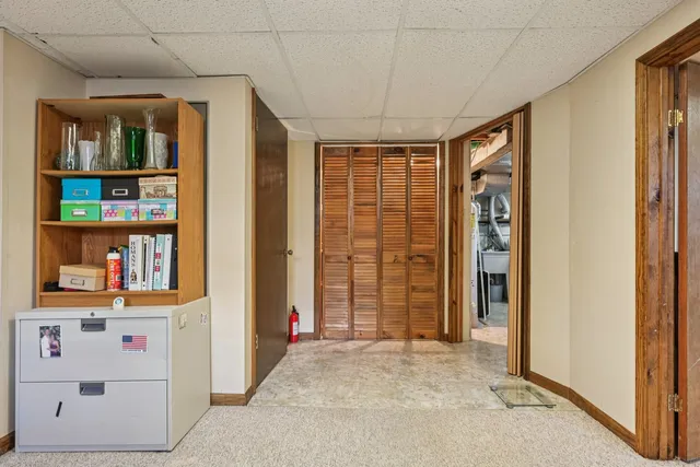 a view of a livingroom with furniture and a car
