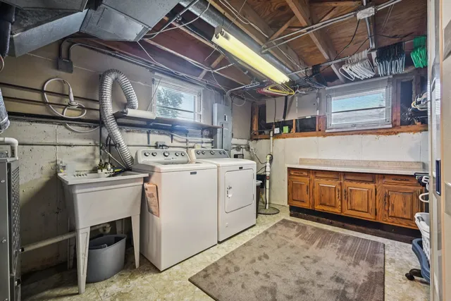 a front view of a house with outdoor seating