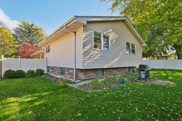 a view of a house with a yard porch and sitting area