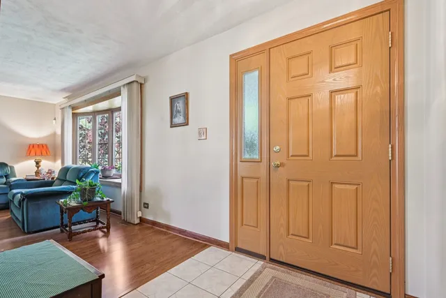 a view of a livingroom with furniture and a window