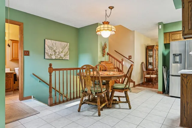 a view of a dining room with furniture and a chandelier