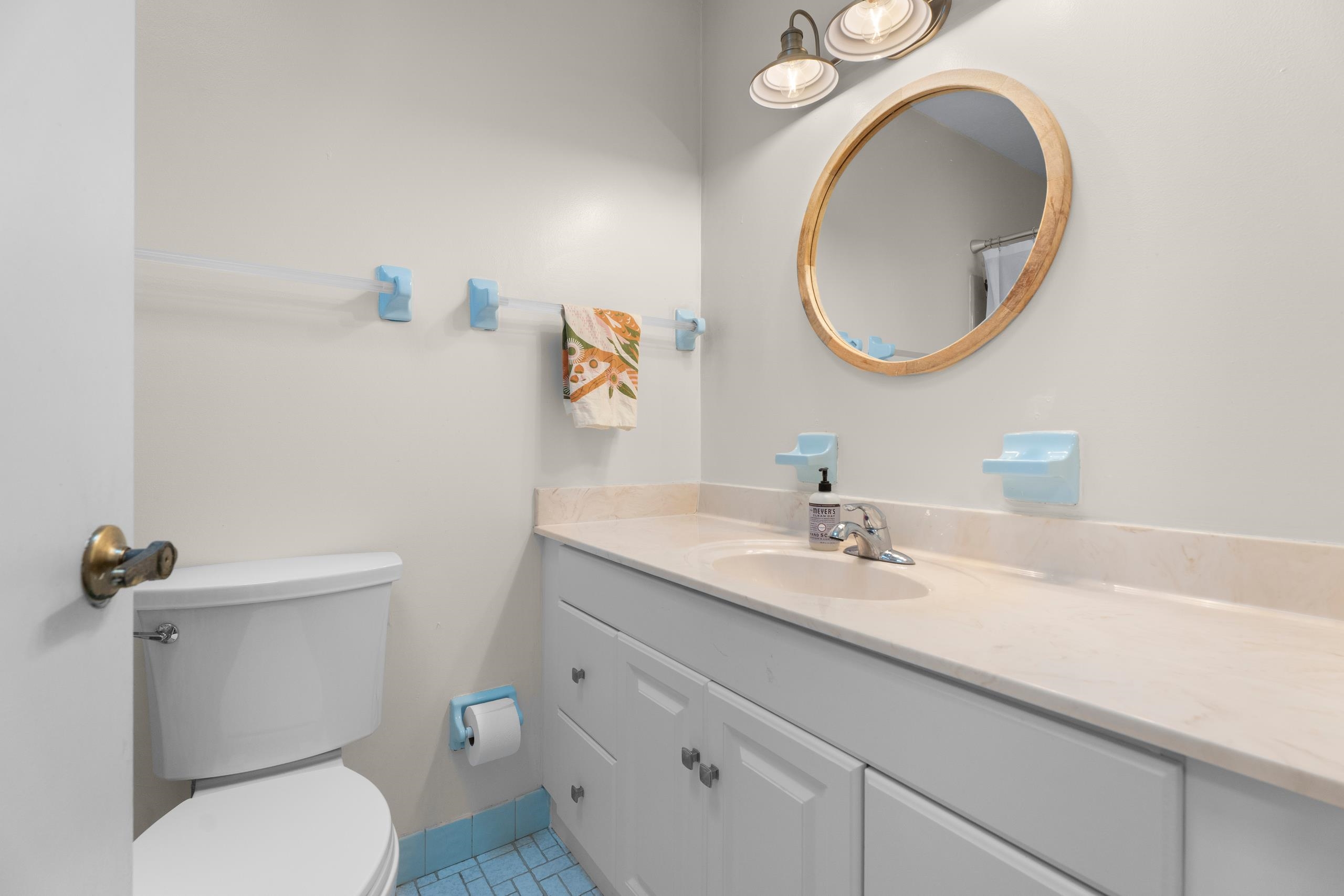 111 Pompano Road St. Augustine, FL 32086 - Photo 21 of 61 a bathroom with a granite countertop toilet sink and mirror