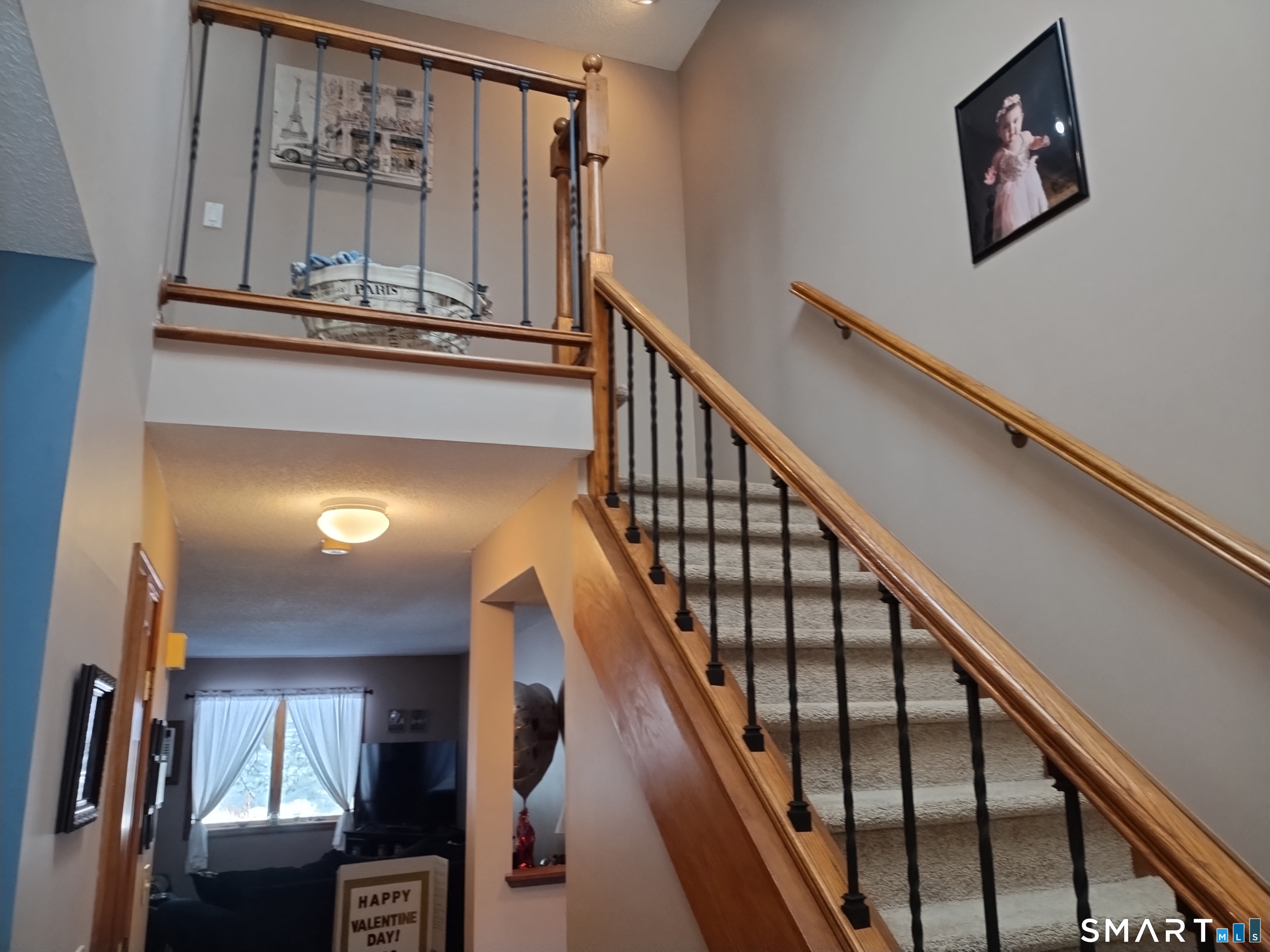 3 Westside Drive, Unit 14 Thompson, CT 06255 - Photo 11 of 22 a view of staircase with wooden floor and painting on the wall