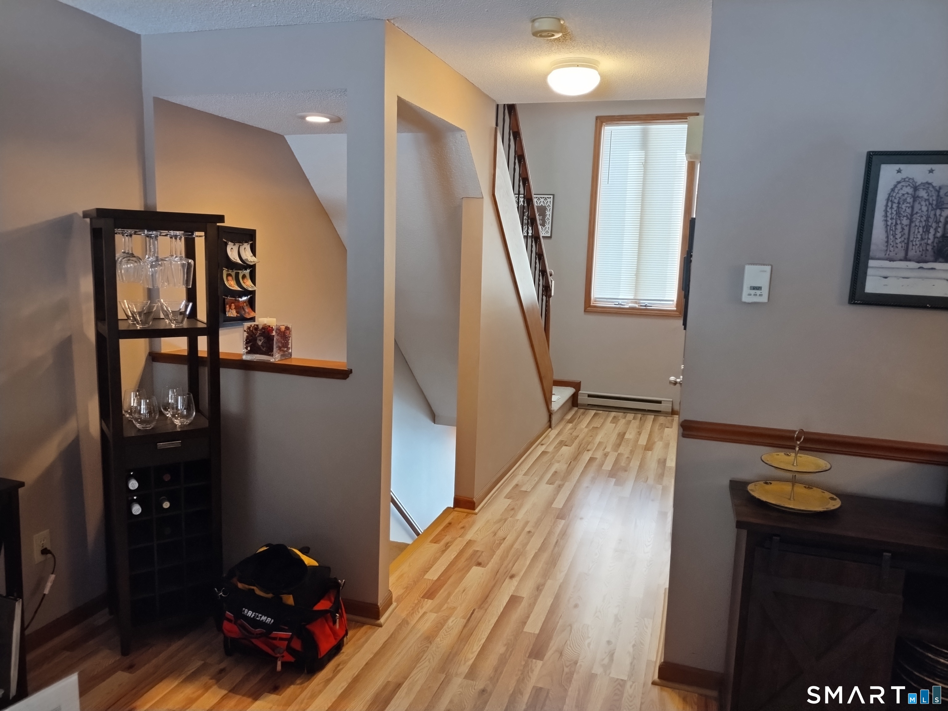 3 Westside Drive, Unit 14 Thompson, CT 06255 - Photo 14 of 22 a view of entryway with stairs and wooden floor