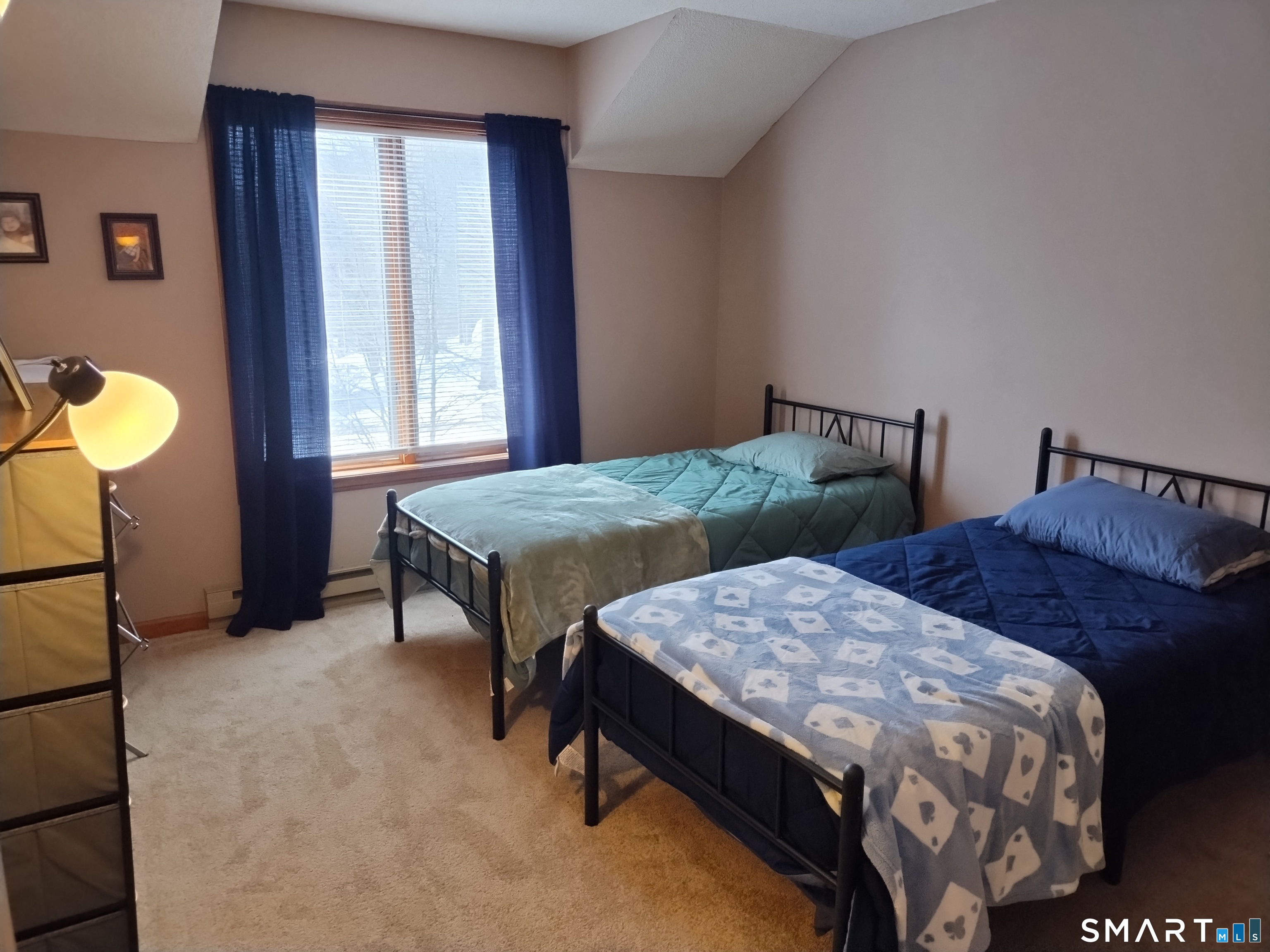 3 Westside Drive, Unit 14 Thompson, CT 06255 - Photo 15 of 22 a bedroom with two beds and a window