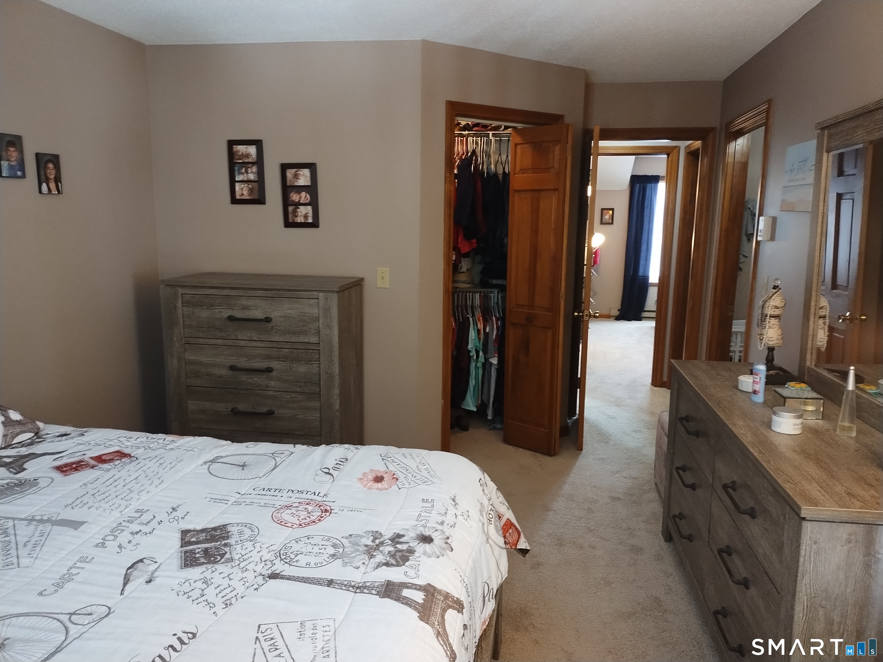 3 Westside Drive, Unit 14 Thompson, CT 06255 - Photo 17 of 22 a bedroom with a bed and a dresser