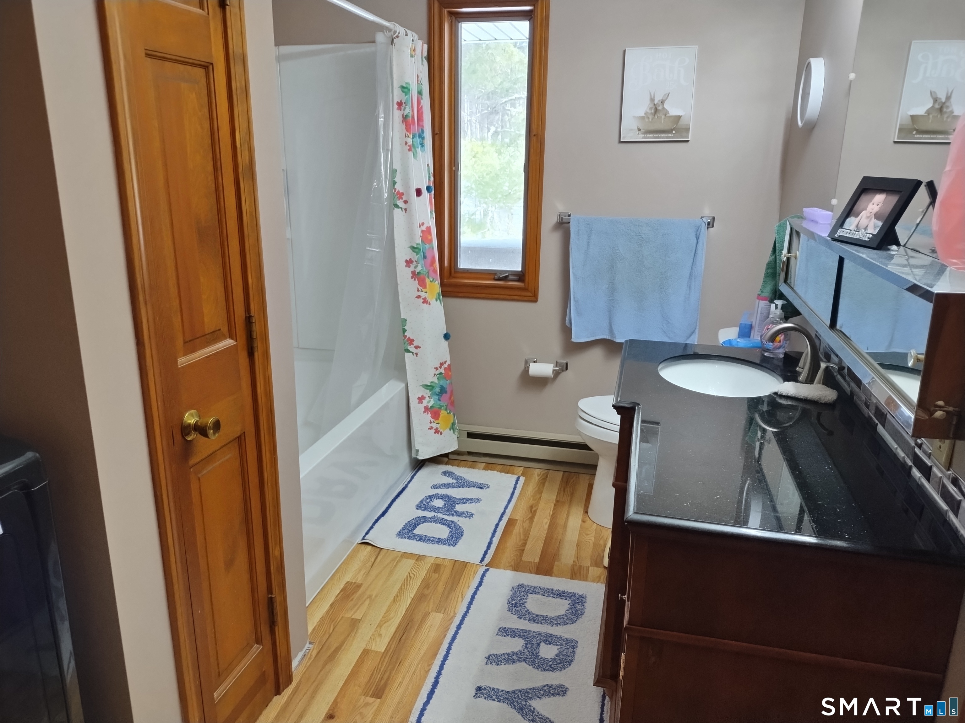 3 Westside Drive, Unit 14 Thompson, CT 06255 - Photo 19 of 22 a bathroom with a sink and a mirror