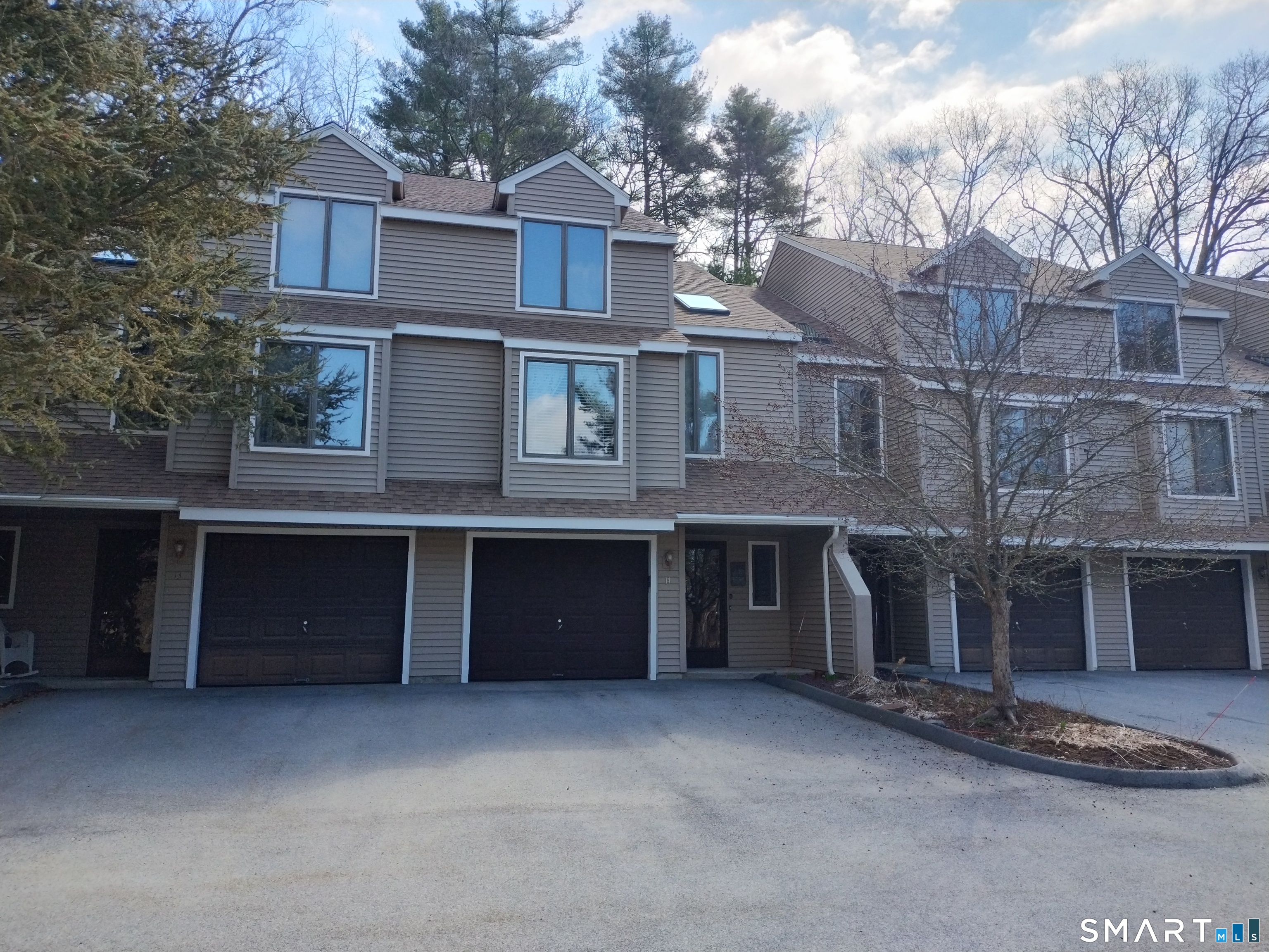 3 Westside Drive, Unit 14 Thompson, CT 06255 - Photo 2 of 22 a front view of a building with a yard