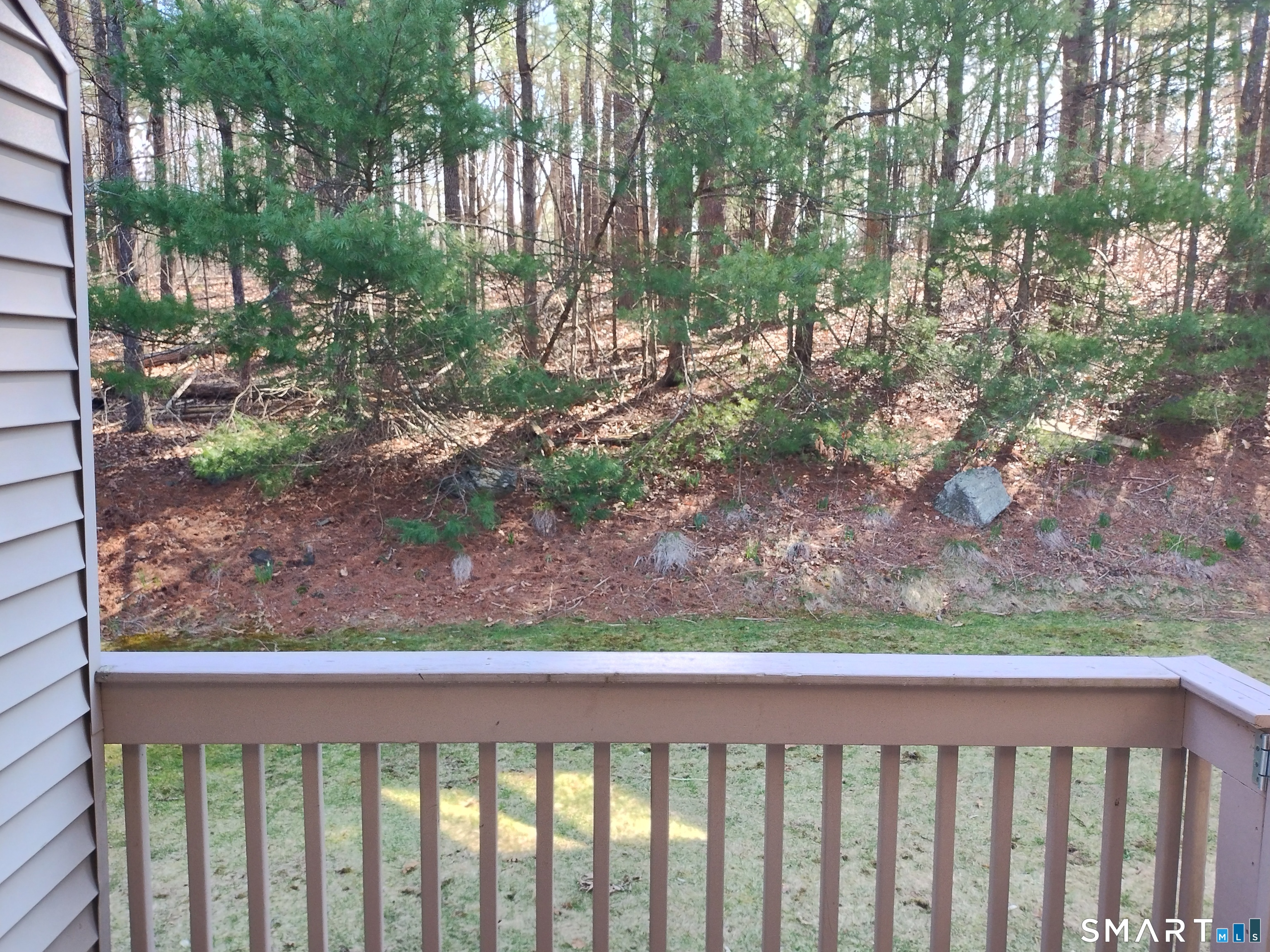 3 Westside Drive, Unit 14 Thompson, CT 06255 - Photo 3 of 22 a view of a yard from a balcony