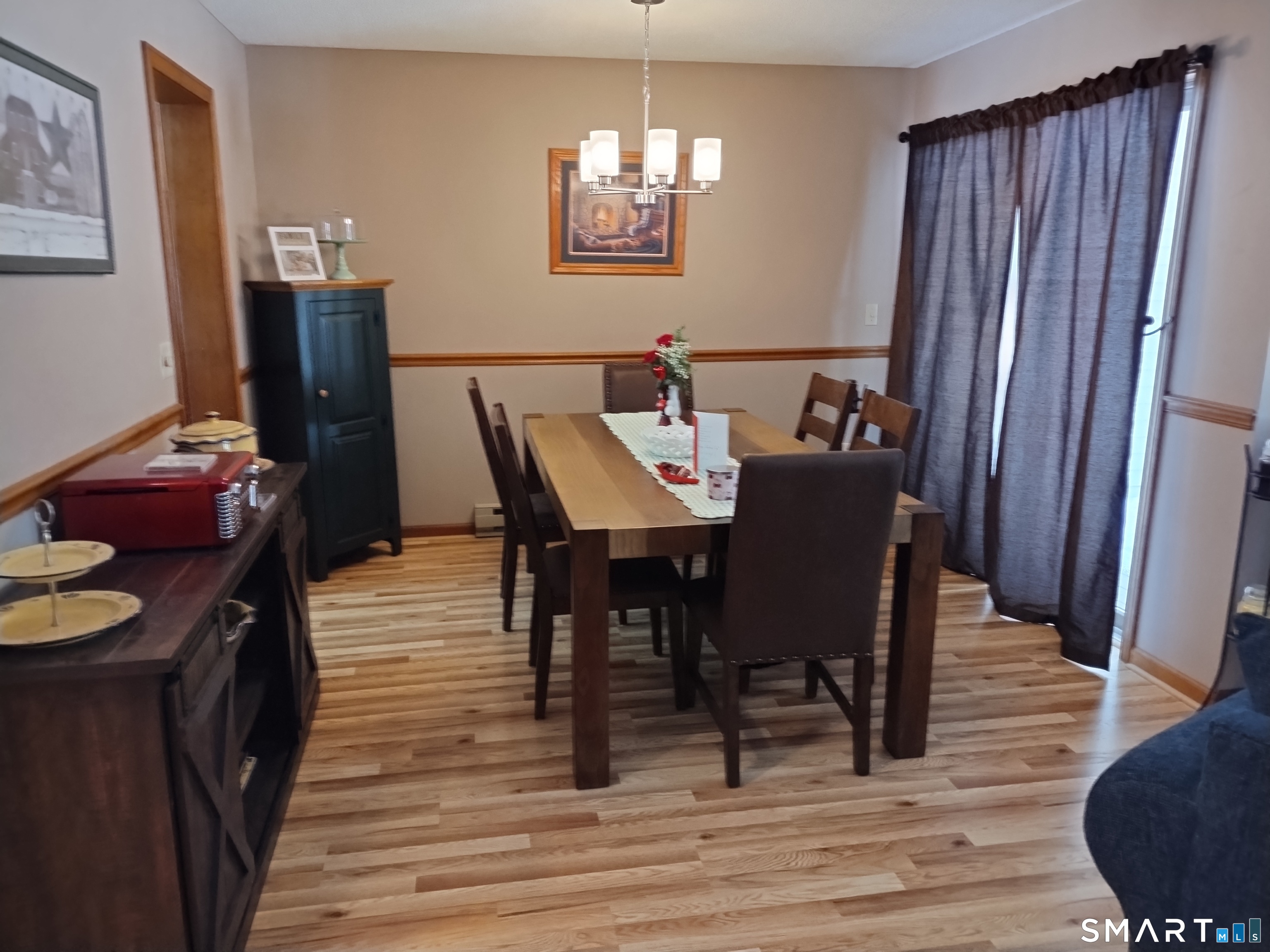 3 Westside Drive, Unit 14 Thompson, CT 06255 - Photo 8 of 22 a view of a dining room with furniture and wooden floor