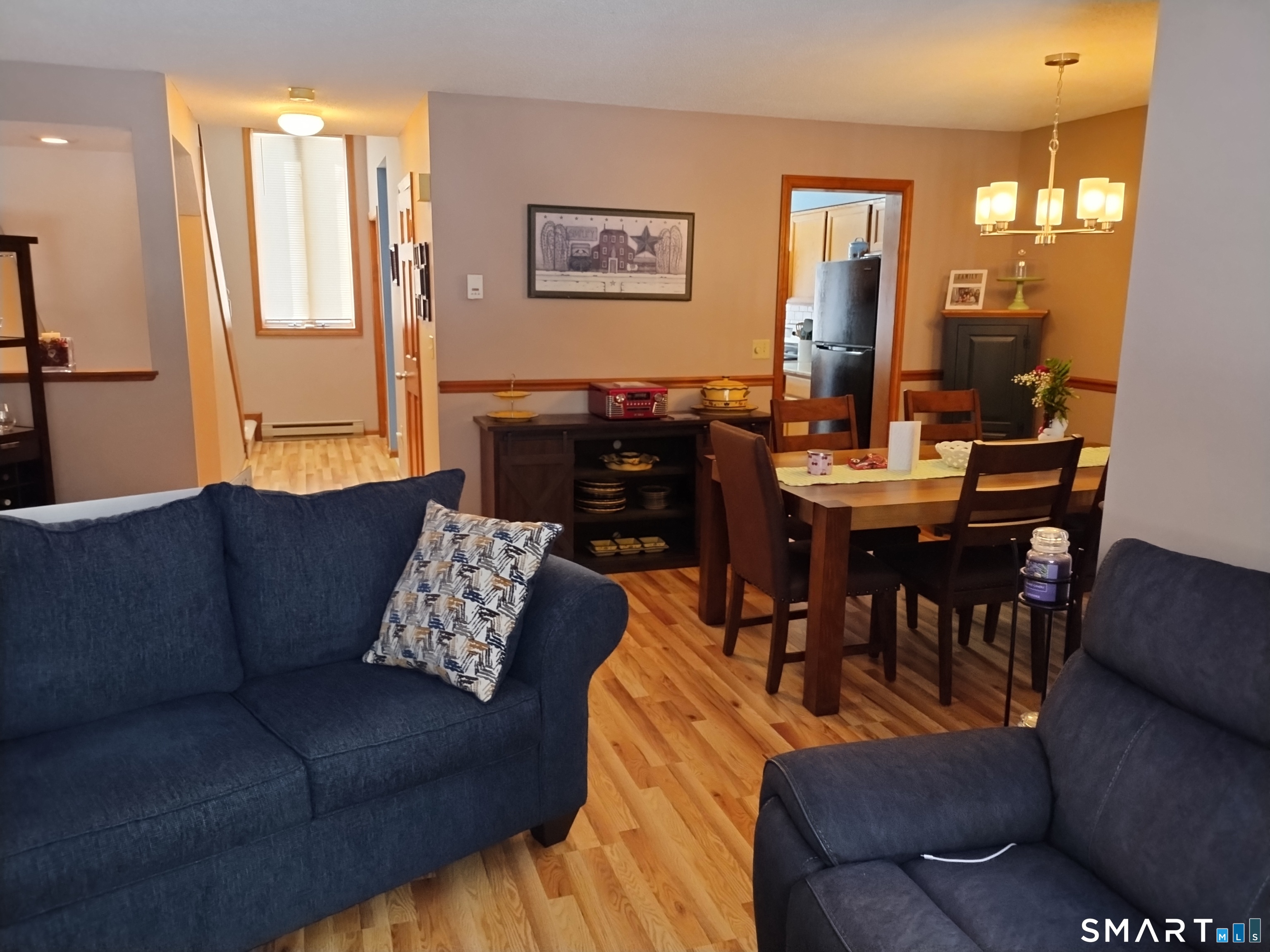 3 Westside Drive, Unit 14 Thompson, CT 06255 - Photo 9 of 22 a living room with furniture and wooden floor
