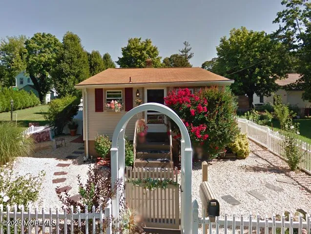 a house view with a garden space