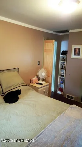 a bed room with a bed and a chair