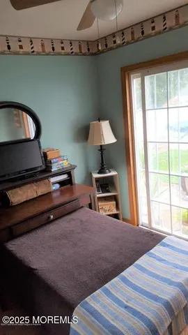 a dining table with chairs and window
