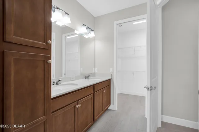 a bathroom with a double vanity sink mirror and double