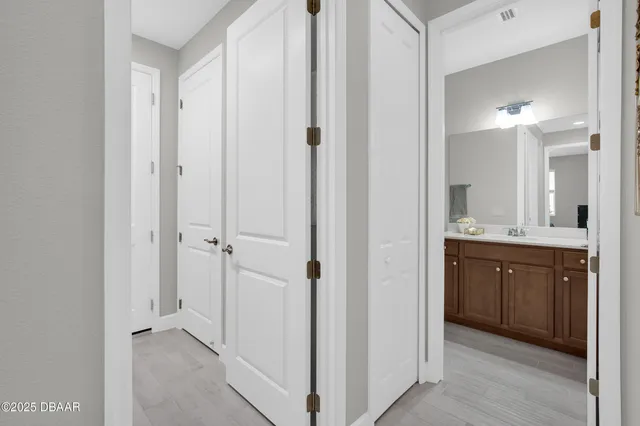 a en suite bathroom with a sink and a mirror