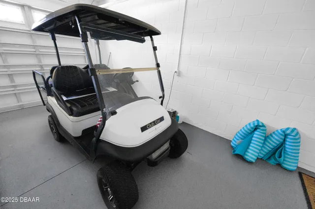 a blue chair sitting in a backyard next to a blue umbrella