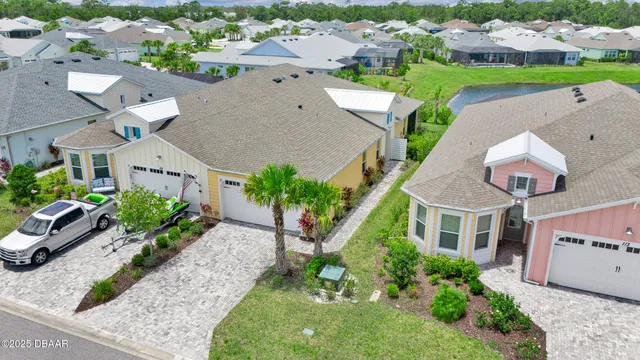 an aerial view of a house with a garden and plants