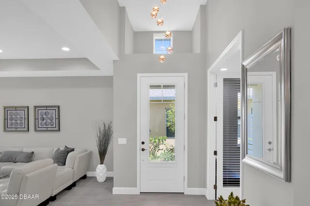 a hallway with furniture and window