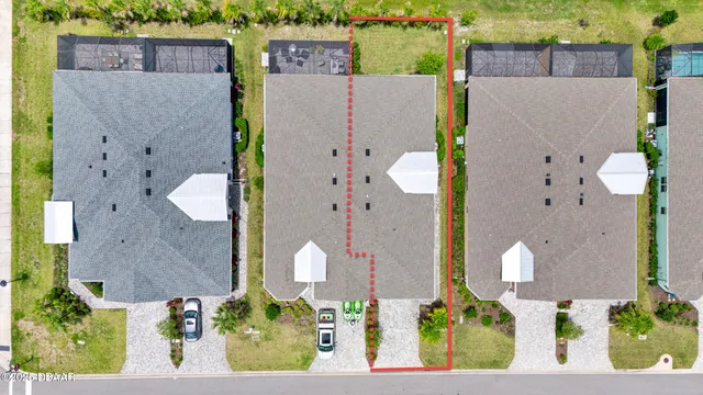 an aerial view of a house with outdoor space