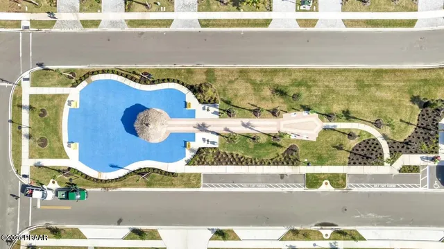 a view of a swimming pool with a lawn chairs