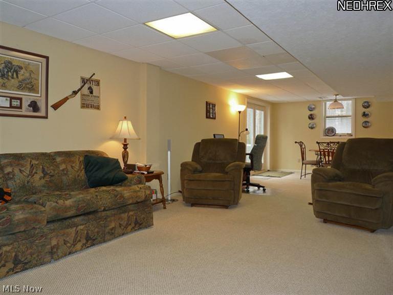 16532 Haskins Road Bainbridge, OH 44023 - Photo 8 of 19 WALKOUT LOWER LEVEL IS HUGE AND PRCATICALLY DOUBLES THE OVERALL LIVING SPACE (NOT COUNTED IN HOME'S SQUARE FEET.