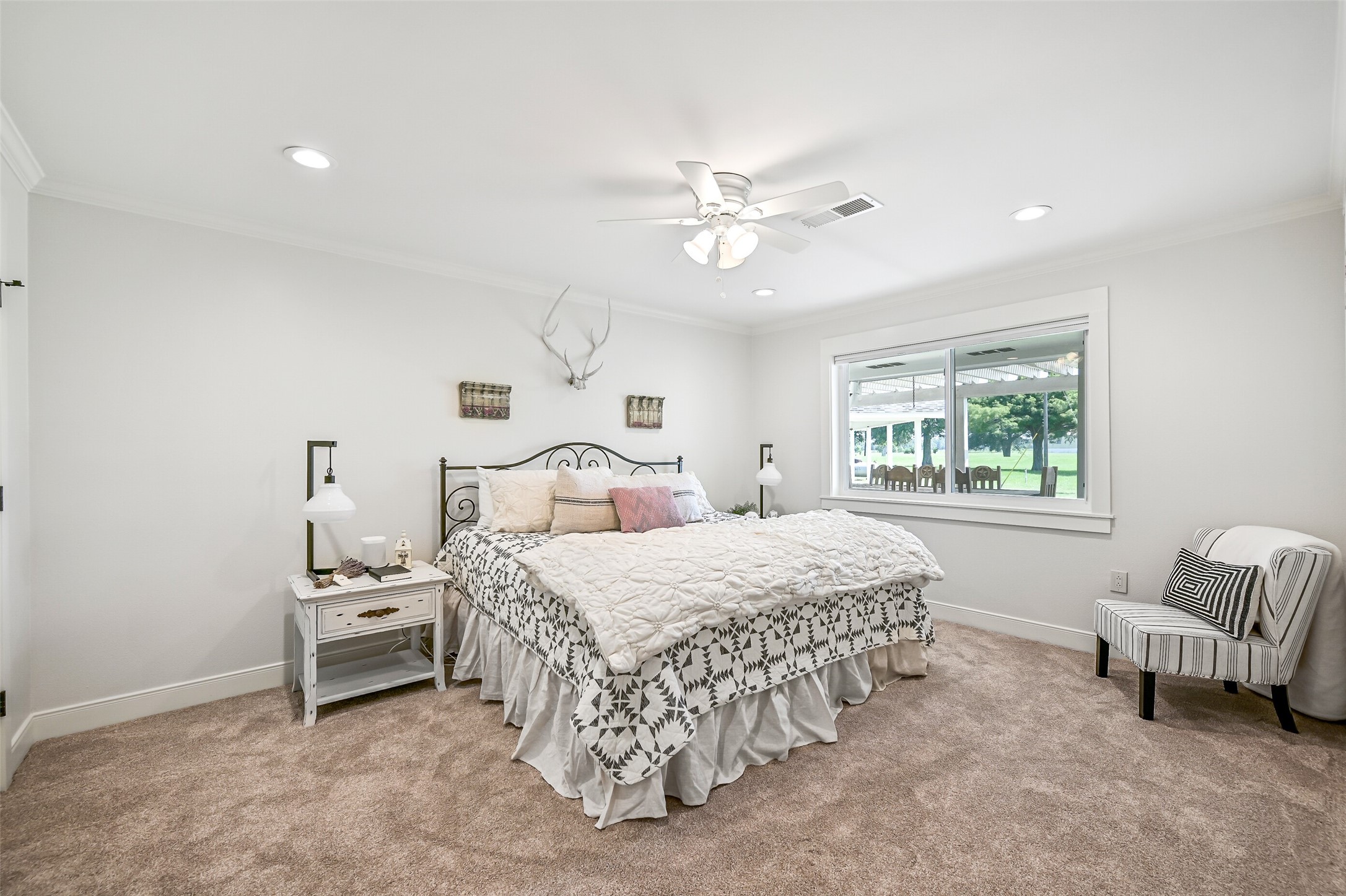 3042 Poskey Road Anahuac, TX 77514 - Photo 22 of 50 a bedroom with a bed and a window