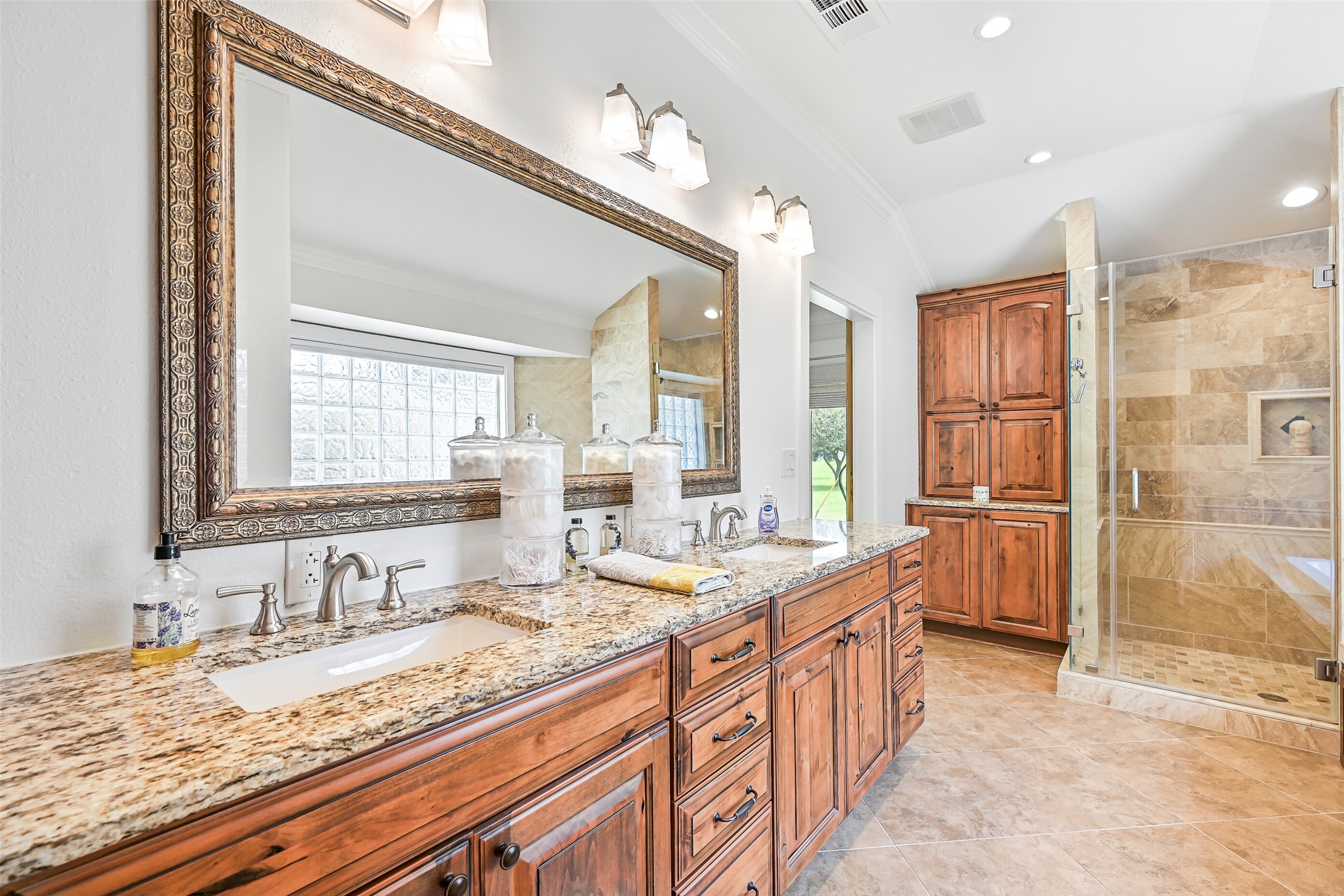 3042 Poskey Road Anahuac, TX 77514 - Photo 35 of 50 a bathroom with a granite countertop sink mirror and a bath tub