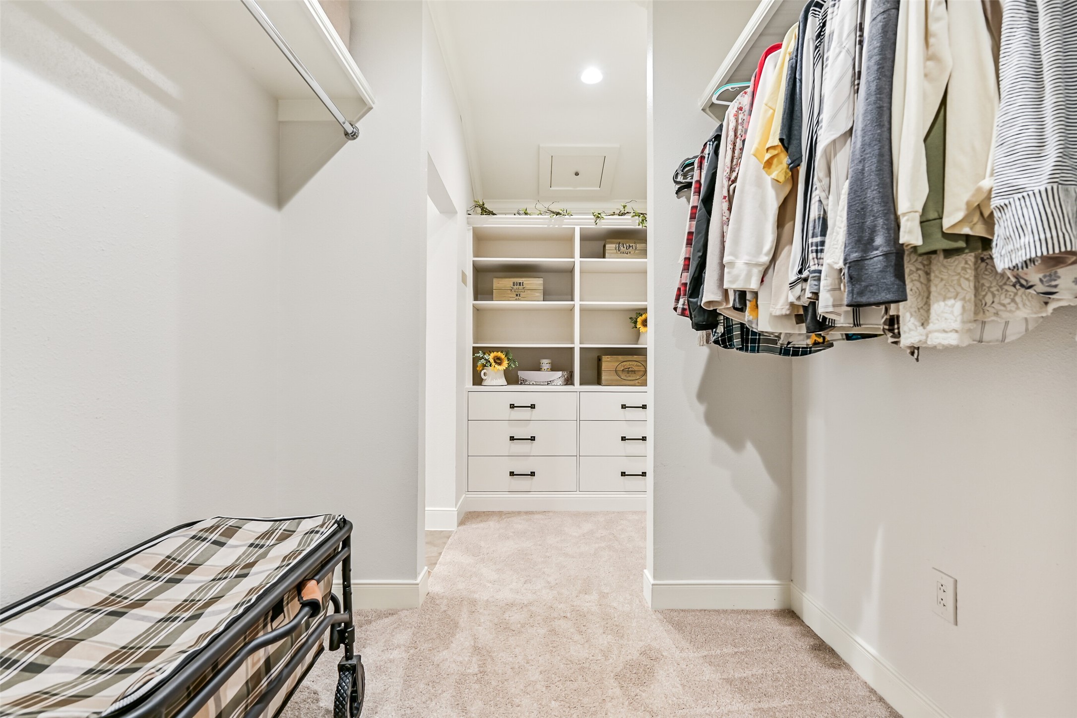 3042 Poskey Road Anahuac, TX 77514 - Photo 37 of 50 a view of walk in closet with clothes and shoes