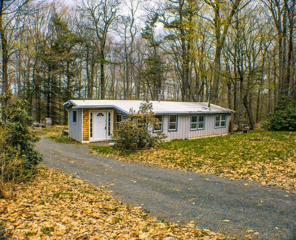 9 Deer Run Path Heath, MA 01346 - Photo 2 of 32 a front view of a house with a yard