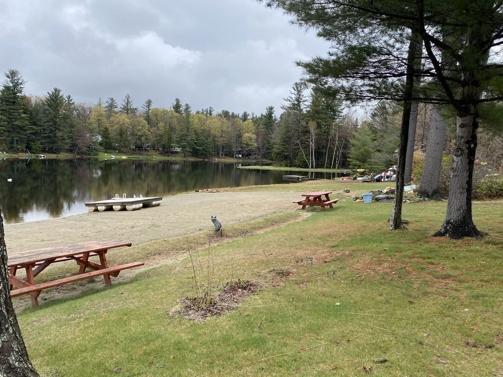9 Deer Run Path Heath, MA 01346 - Photo 24 of 32 a view of a lake with a yard and a large tree