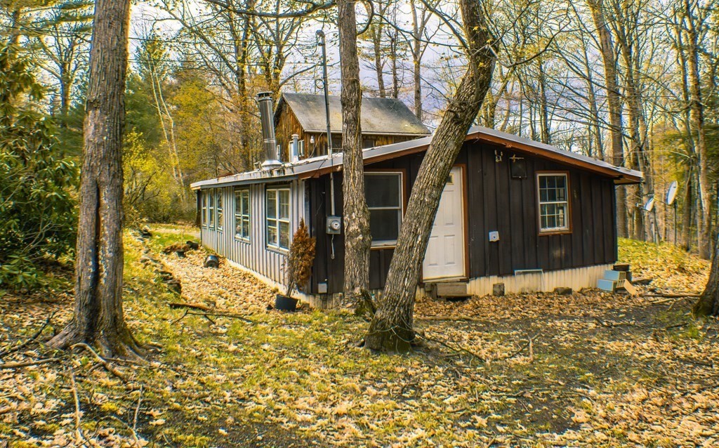 9 Deer Run Path Heath, MA 01346 - Photo 4 of 32 front view of a house with a yard