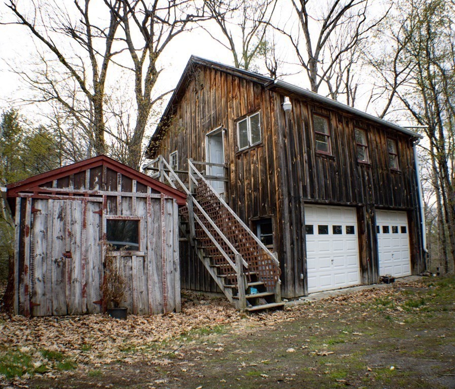 9 Deer Run Path Heath, MA 01346 - Photo 8 of 32 a view of a house with a wooden house