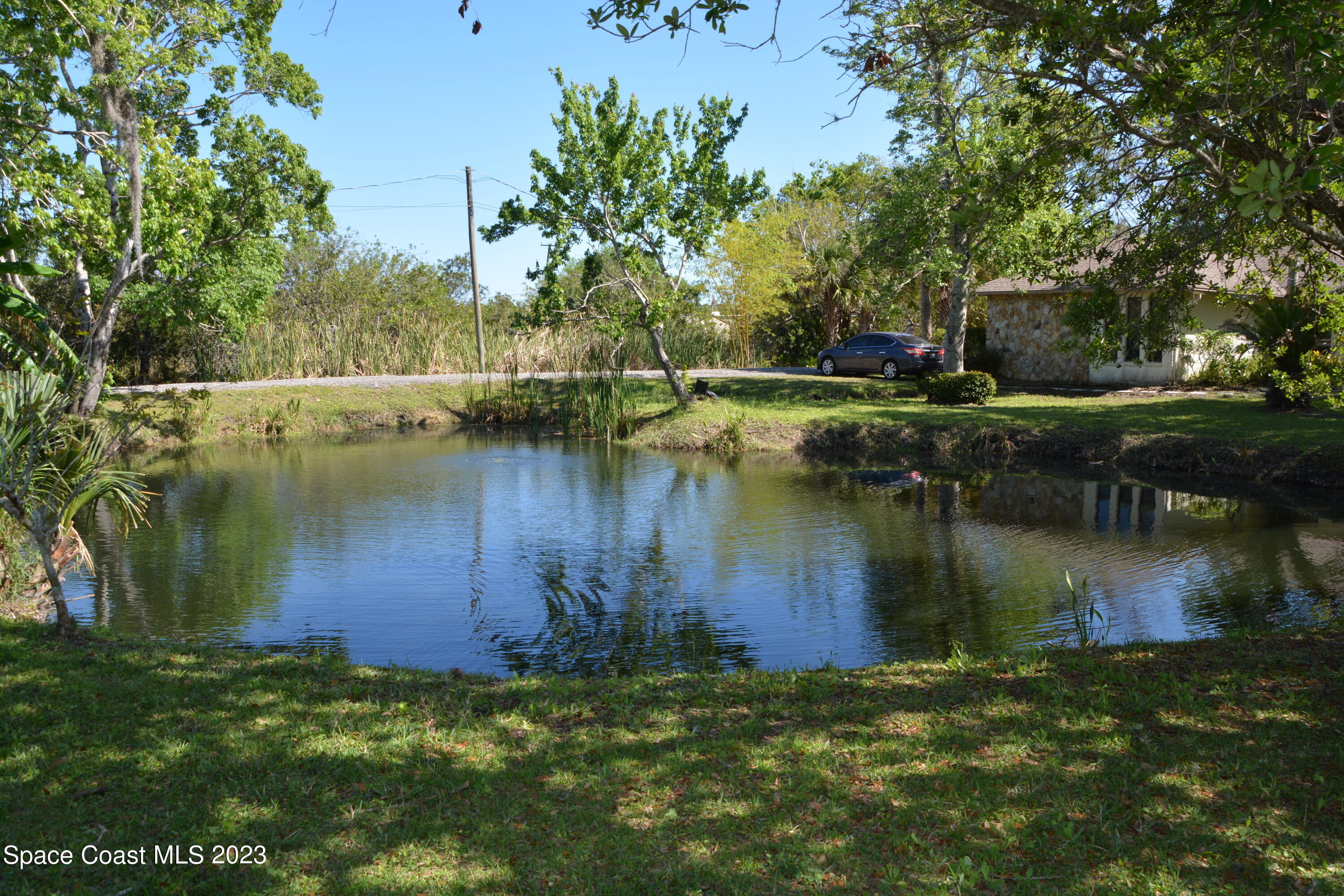 1045 Pine Island Road Merritt Island, FL 32953 - Photo 3 of 42 a view of a lake