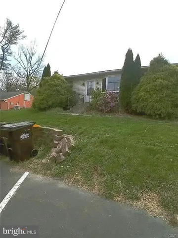 a view of a big yard with a house