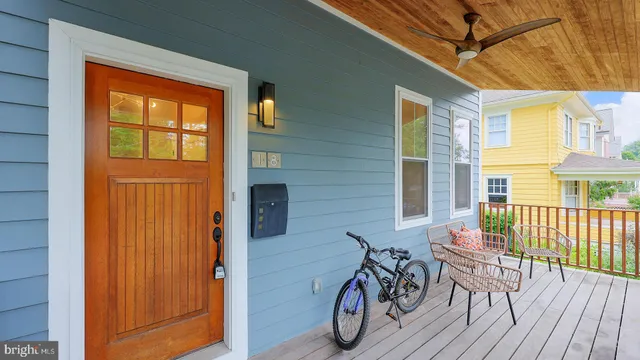 a view of a patio with table and chairs