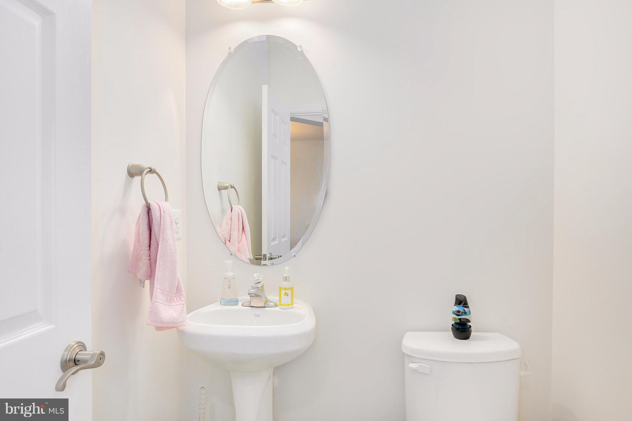 17670 Possum Point Road Dumfries, VA 22026 - Photo 14 of 29 a bathroom with a sink and a mirror
