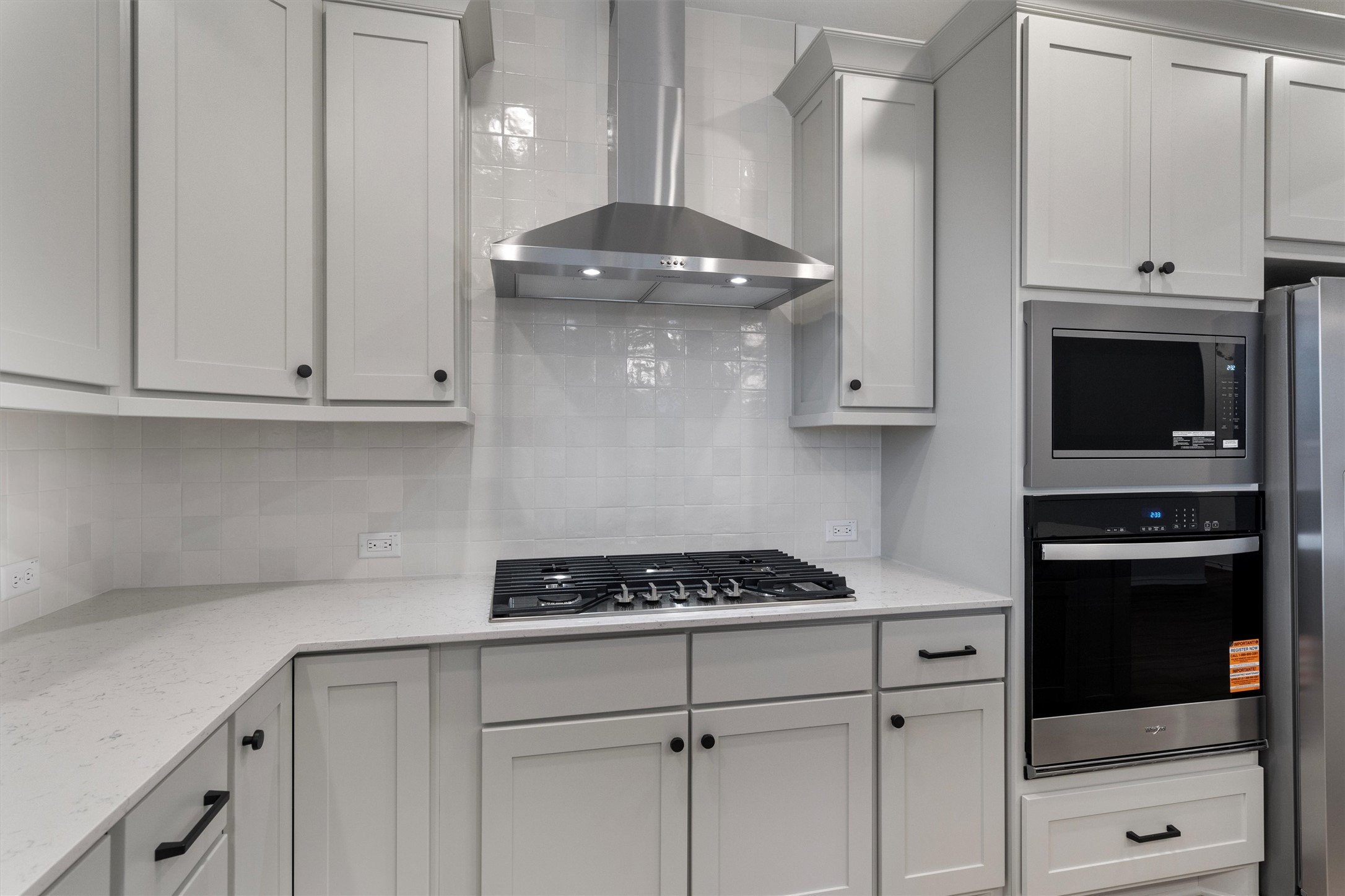 310 Livewater Lane Georgetown, TX 78633 - Photo 16 of 33 a kitchen with stainless steel appliances granite countertop a stove a microwave and cabinets