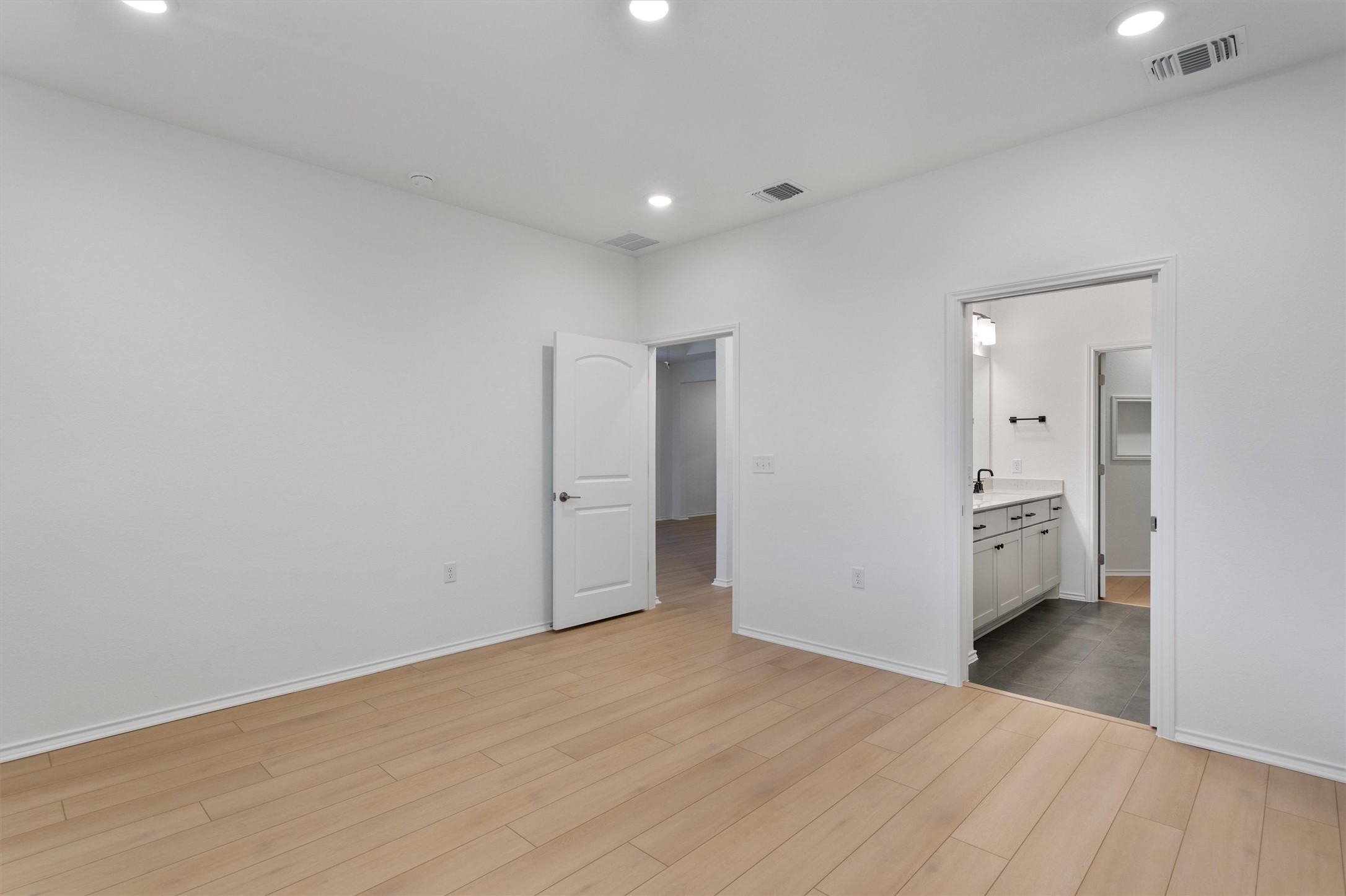 310 Livewater Lane Georgetown, TX 78633 - Photo 19 of 33 a view of a big room with wooden floor and windows