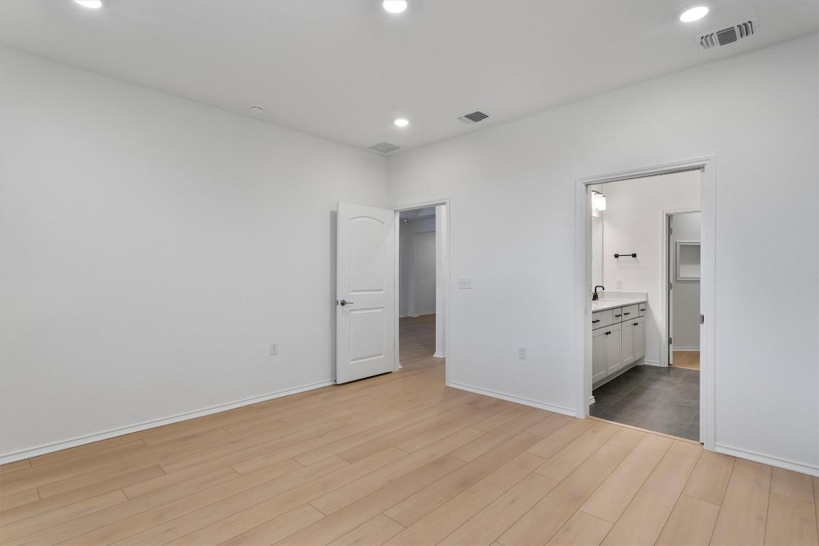 310 Livewater Lane Georgetown, TX 78633 - Photo 19 of 33 a view of a big room with wooden floor and windows