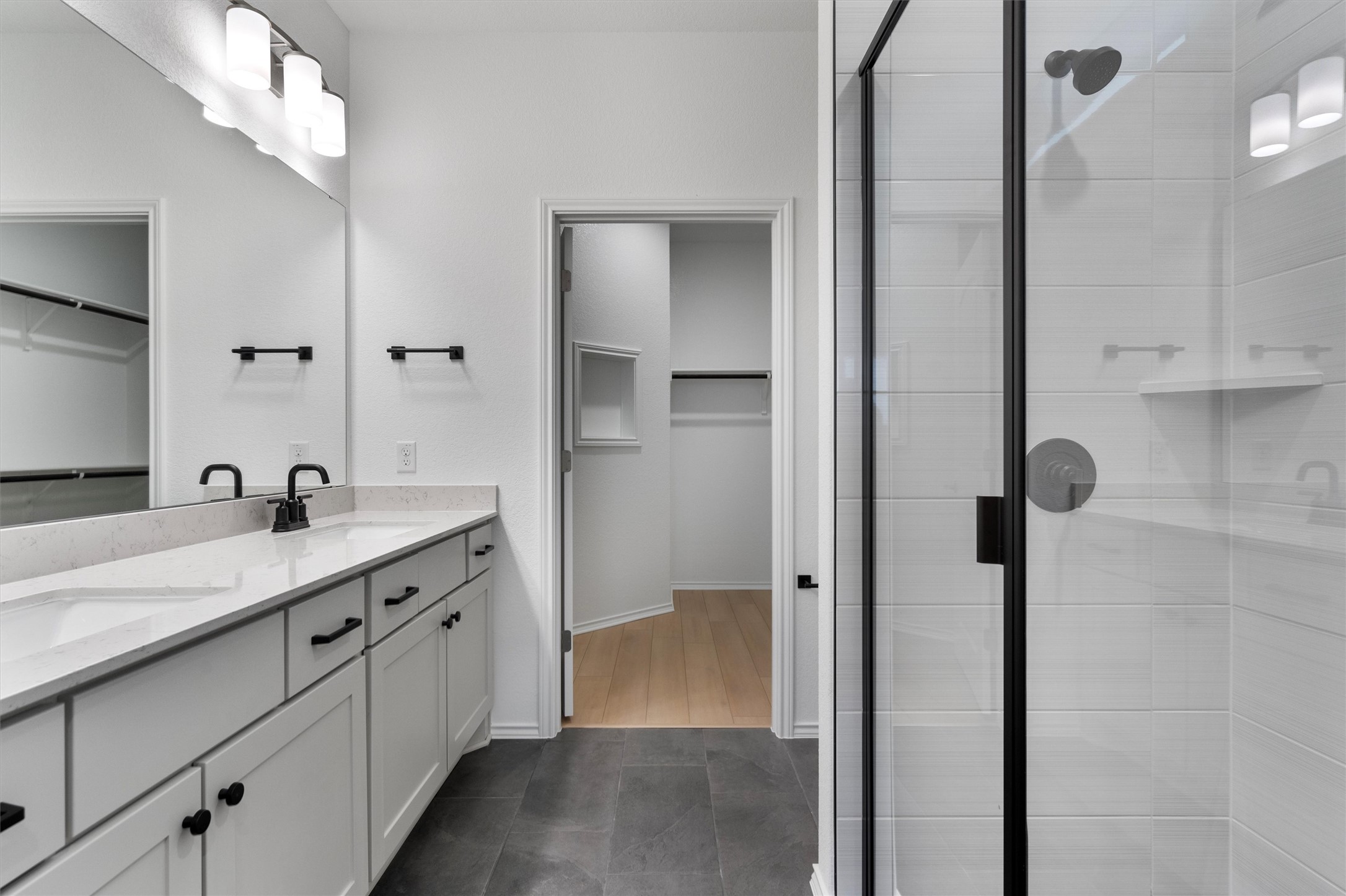 310 Livewater Lane Georgetown, TX 78633 - Photo 21 of 33 a bathroom with a granite countertop sink mirror and a shower