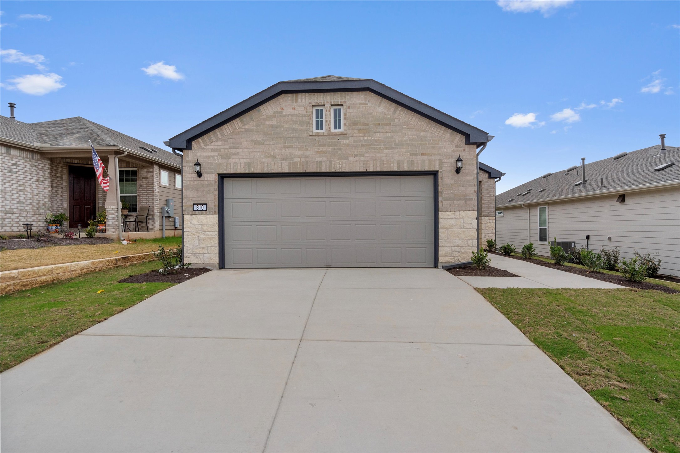 310 Livewater Lane Georgetown, TX 78633 - Photo 3 of 33 a front view of a house with a yard and garage