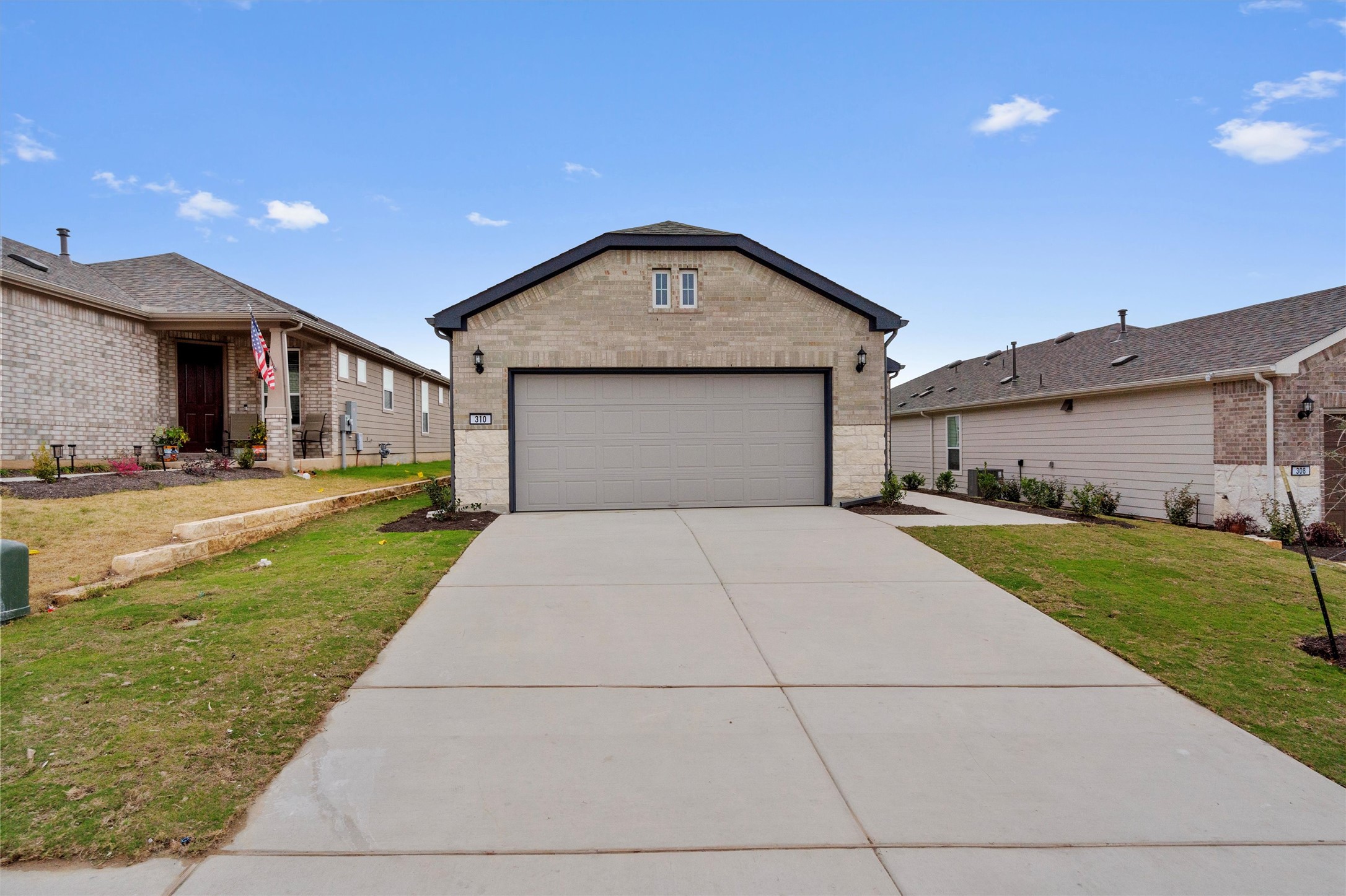310 Livewater Lane Georgetown, TX 78633 - Photo 4 of 33 a front view of a house with a yard and garage