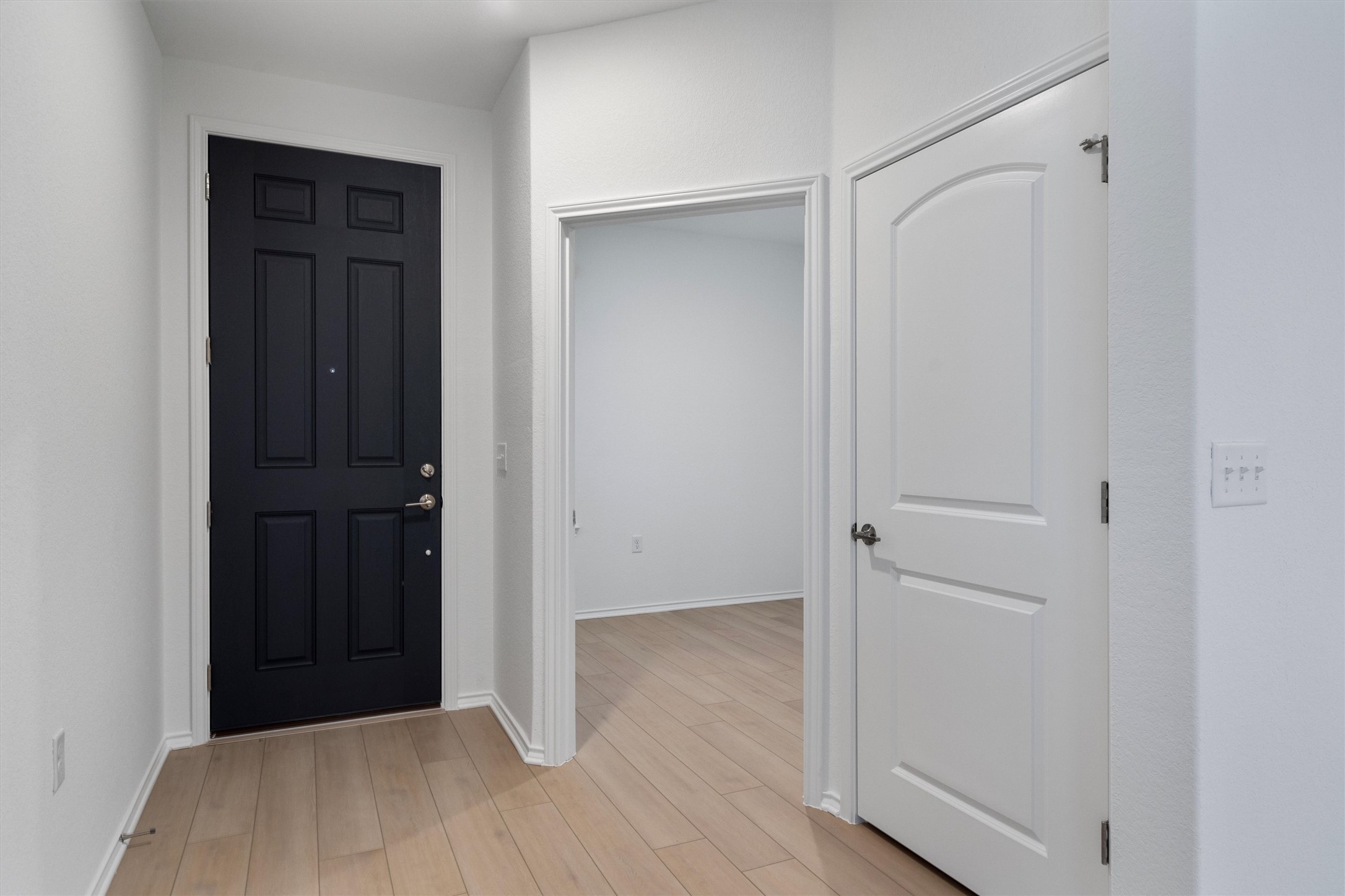 310 Livewater Lane Georgetown, TX 78633 - Photo 6 of 33 a view of hallway with wooden floor