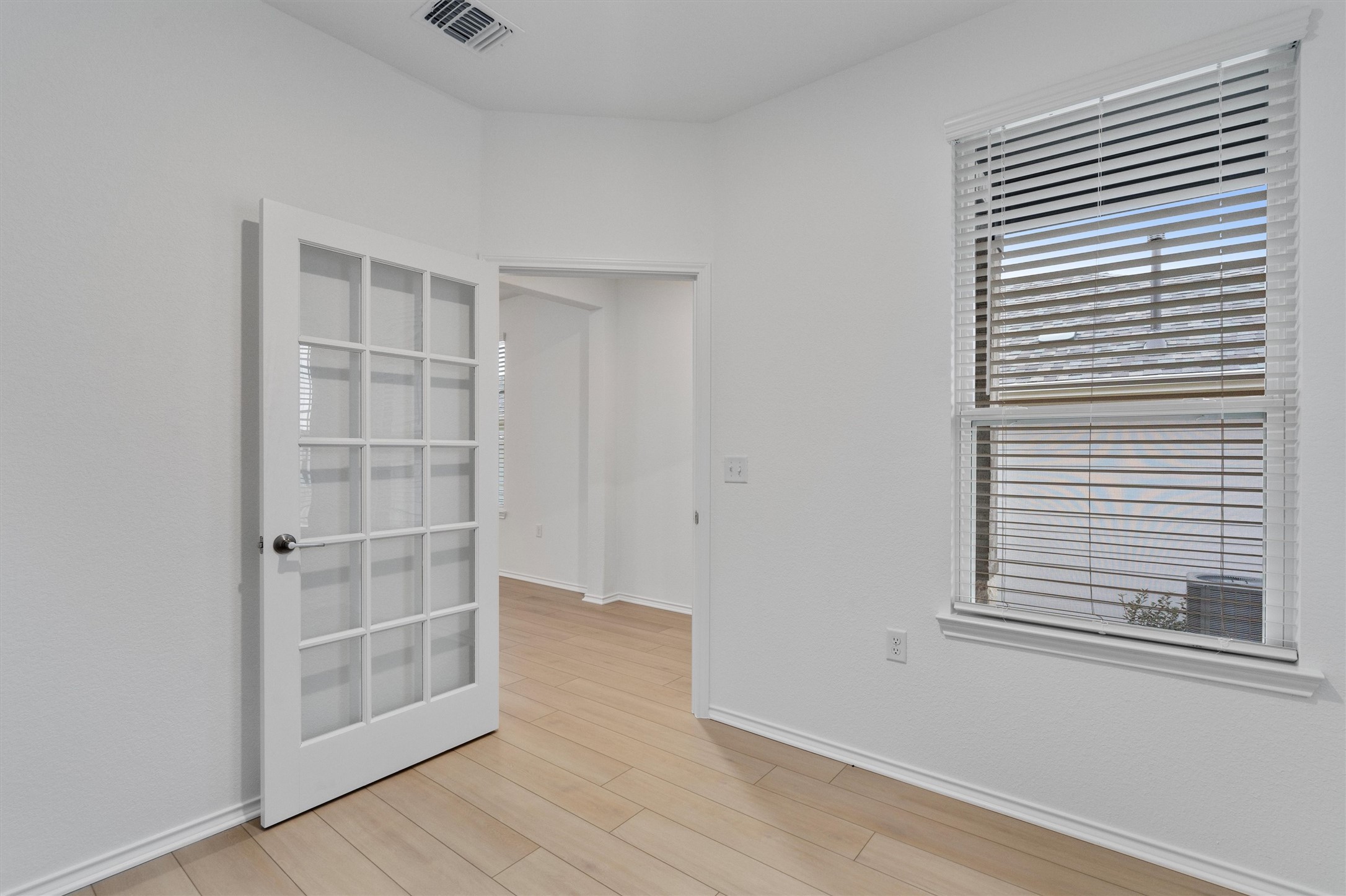 310 Livewater Lane Georgetown, TX 78633 - Photo 8 of 33 a view of empty room with wooden floor and fan