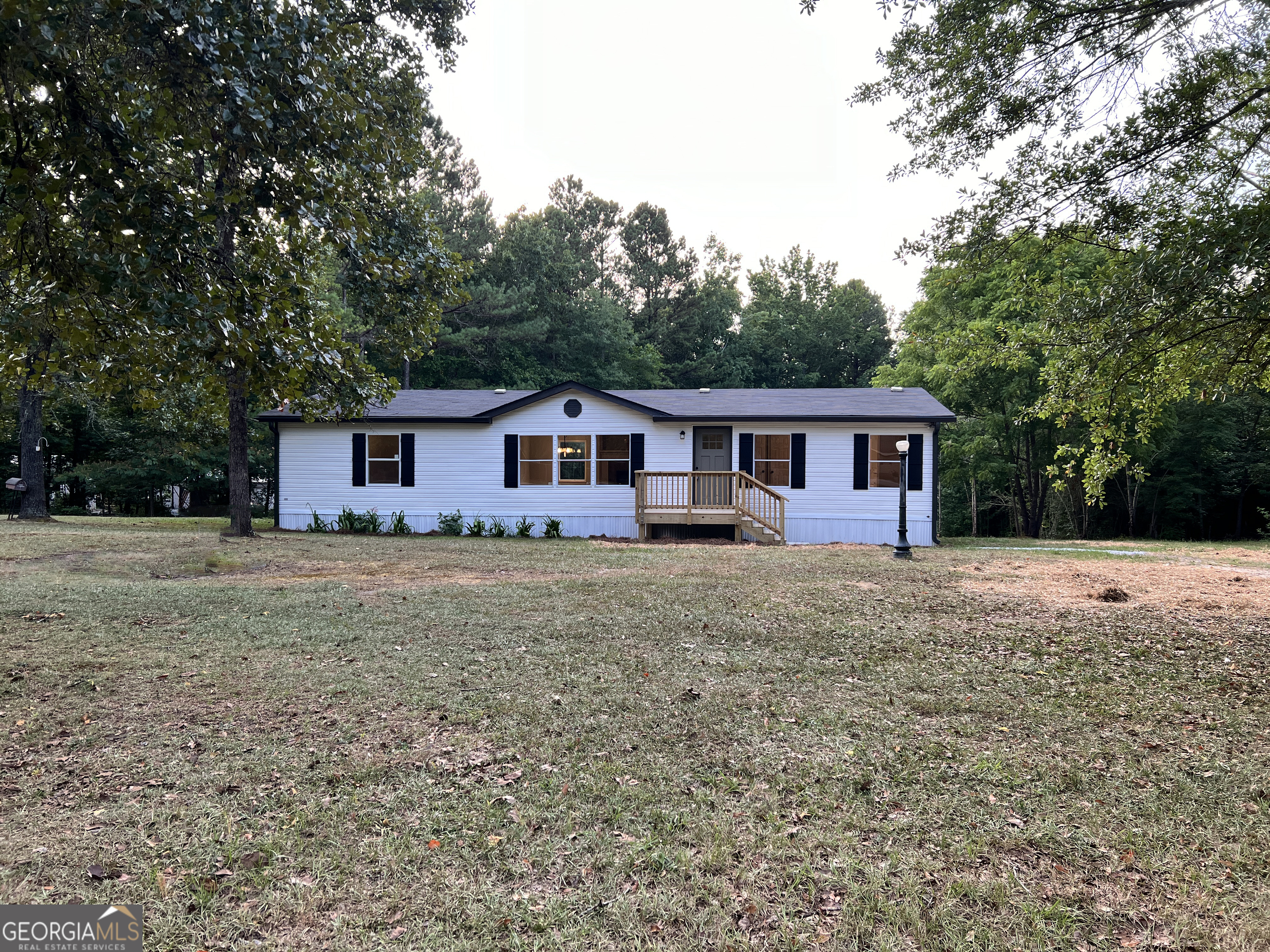 560 Poseyville Road Bremen, GA 30110 - Photo 1 of 1 a front view of house with yard and trees