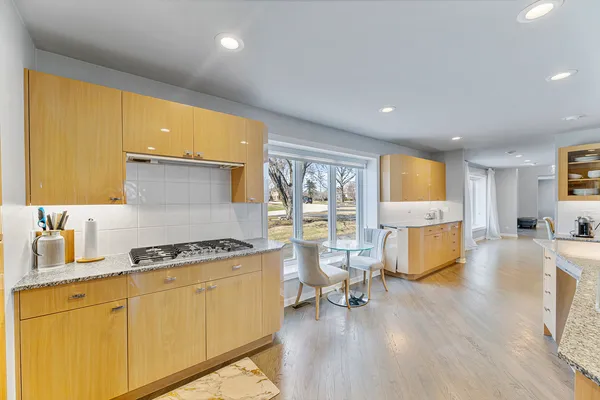 a kitchen with stainless steel appliances granite countertop a refrigerator oven a sink and dishwasher