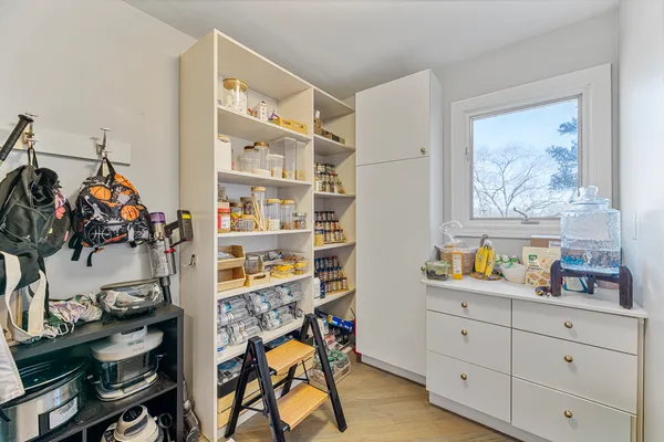 a bathroom with a granite countertop sink mirror and toilet