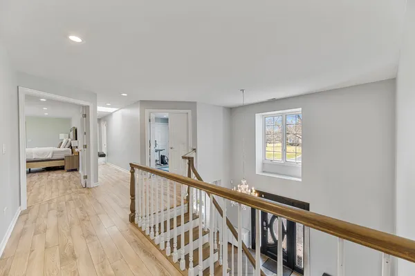 a spacious bedroom with a bed and a fireplace
