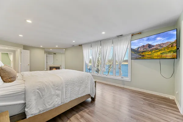 a bathroom with a tub sink and mirror
